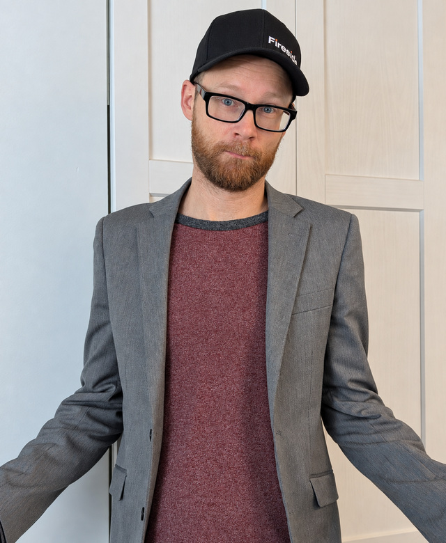 Jesse Barton, founder of Simplecraft Digital, wearing a Fireside cap and grey blazer